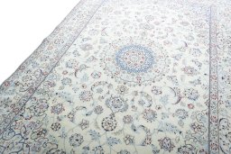 Backside of handmade 2000s Nain rug showing knot structure and weave density