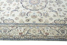Corner detail of 2000s Nain rug showing border pattern and Wool pile