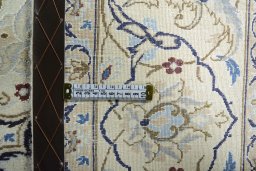 Backside of handmade 2000s Nain rug showing knot structure and weave density
