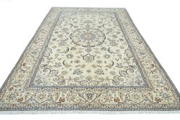 Surface texture of 2000s Nain rug with natural Wool and intricate pattern