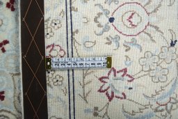 Backside of handmade New Nain rug showing knot structure and weave density