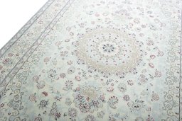 Backside of handmade New Nain rug showing knot structure and weave density