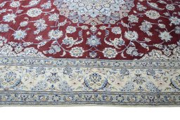 Corner detail of 2000s Nain rug showing border pattern and Wool pile