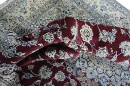 Surface texture of 2000s Nain rug with natural Wool and intricate pattern