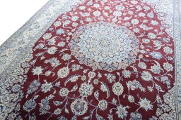 Backside of handmade 2000s Nain rug showing knot structure and weave density