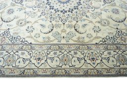 Corner detail of 2000s Nain rug showing border pattern and Wool pile