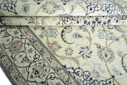 Close-up detail of 2000s Nain rug from Iran / Persia showing Wool weave