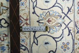 Backside of handmade 2000s Nain rug showing knot structure and weave density