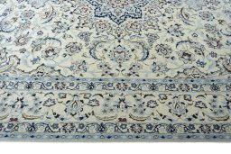 Corner detail of 2000s Nain rug showing border pattern and Wool pile