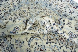 Surface texture of 2000s Nain rug with natural Wool and intricate pattern