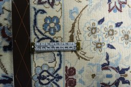 Backside of handmade 2000s Nain rug showing knot structure and weave density