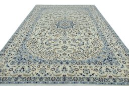 Surface texture of 2000s Nain rug with natural Wool and intricate pattern