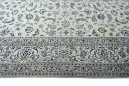 Corner detail of New Nain rug showing border pattern and Wool pile