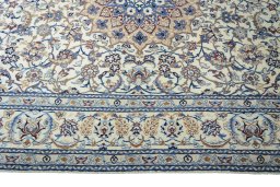 Corner detail of 2000s Nain rug showing border pattern and Wool pile