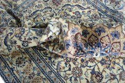 Surface texture of 2000s Nain rug with natural Wool and intricate pattern