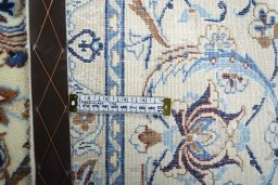 Backside of handmade 2000s Nain rug showing knot structure and weave density
