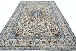 Surface texture of 2000s Nain rug with natural Wool and intricate pattern