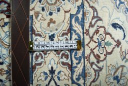 Surface texture of 2000s Nain rug with natural Wool and intricate pattern