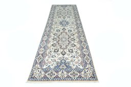 Surface texture of 2000s Nain rug with natural Wool and intricate pattern