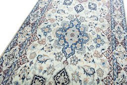 Backside of handmade 2000s Nain rug showing knot structure and weave density