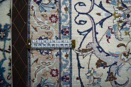 Backside of handmade 2000s Nain rug showing knot structure and weave density