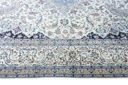 Corner detail of 2000s Nain rug showing border pattern and Cork pile