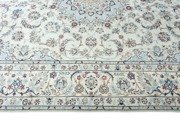 Corner detail of 2000s Nain rug showing border pattern and Wool pile