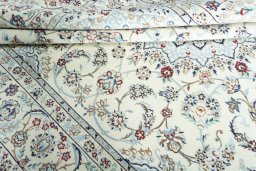 Close-up detail of 2000s Nain rug from Iran / Persia showing Wool weave