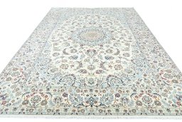 Surface texture of 2000s Nain rug with natural Wool and intricate pattern