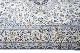 Corner detail of 2000s Nain rug showing border pattern and Wool pile