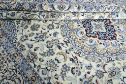 Close-up detail of 2000s Nain rug from Iran / Persia showing Wool weave