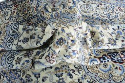 Surface texture of 2000s Nain rug with natural Wool and intricate pattern