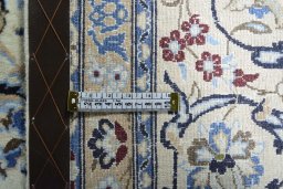 Backside of handmade 2000s Nain rug showing knot structure and weave density