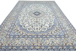 Surface texture of 2000s Nain rug with natural Wool and intricate pattern