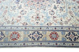 Corner detail of 2000s Nain rug showing border pattern and Wool pile