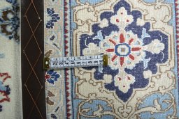 Backside of handmade 2000s Nain rug showing knot structure and weave density