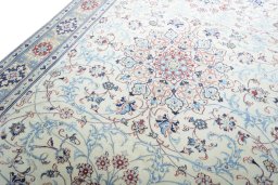 Backside of handmade 2000s Nain rug showing knot structure and weave density