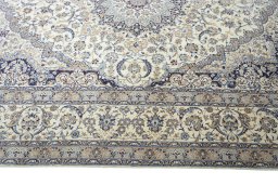 Corner detail of 2000s Nain rug showing border pattern and Cork pile
