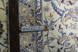 Backside of handmade 2000s Nain rug showing knot structure and weave density