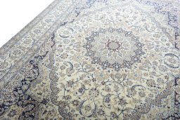 Backside of handmade 2000s Nain rug showing knot structure and weave density