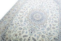 Backside of handmade New Nain rug showing knot structure and weave density