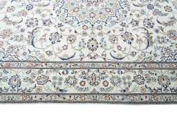 Corner detail of New Nain rug showing border pattern and Wool pile