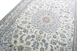 Backside of handmade New Nain rug showing knot structure and weave density