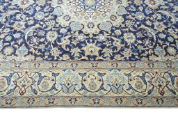 Corner detail of 2000s Nain rug showing border pattern and Wool pile