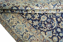 Close-up detail of 2000s Nain rug from Iran / Persia showing Wool weave