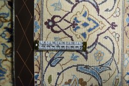 Backside of handmade 2000s Nain rug showing knot structure and weave density