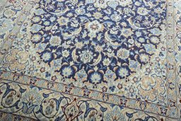 Close-up detail of 2000s Nain rug from Iran / Persia showing Wool weave