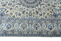 Corner detail of 2000s Nain rug showing border pattern and Wool pile