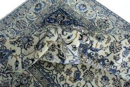 Surface texture of 2000s Nain rug with natural Wool and intricate pattern