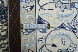 Backside of handmade 2000s Nain rug showing knot structure and weave density